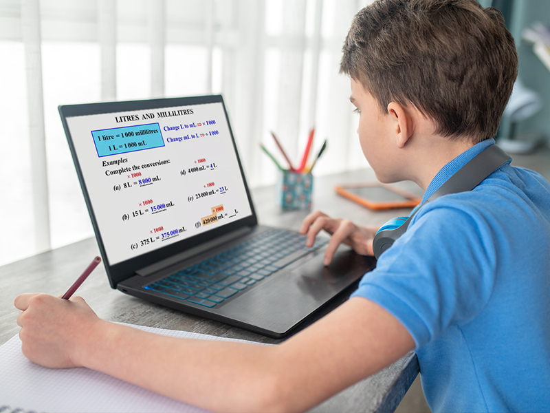 Self paced maths lessons. Image of child working on a maths lesson