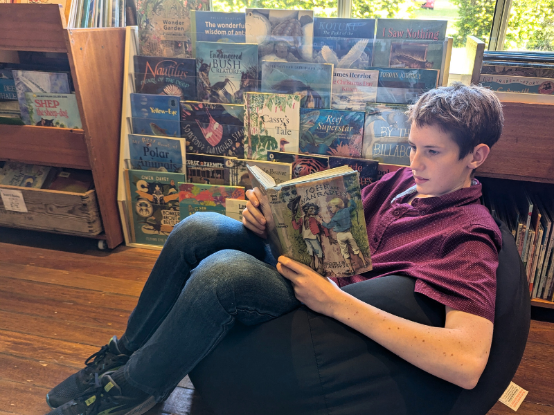 Child reading Charlotte mason Living Books used in Wattle Gum Homeschool Curricullum