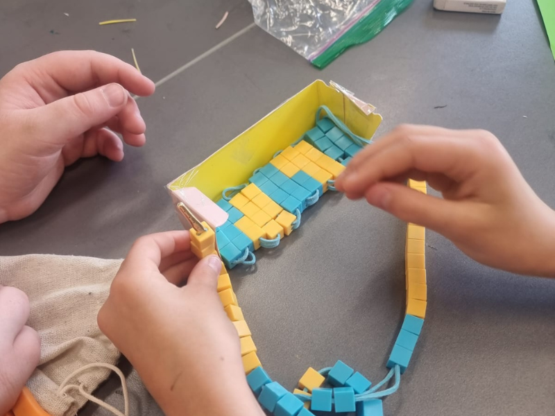 image of child measuring capacity in a homeschool maths lesson using the linear abacus tool