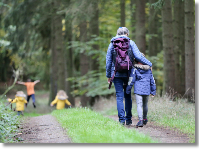 A homeschool family out on a walk in nature