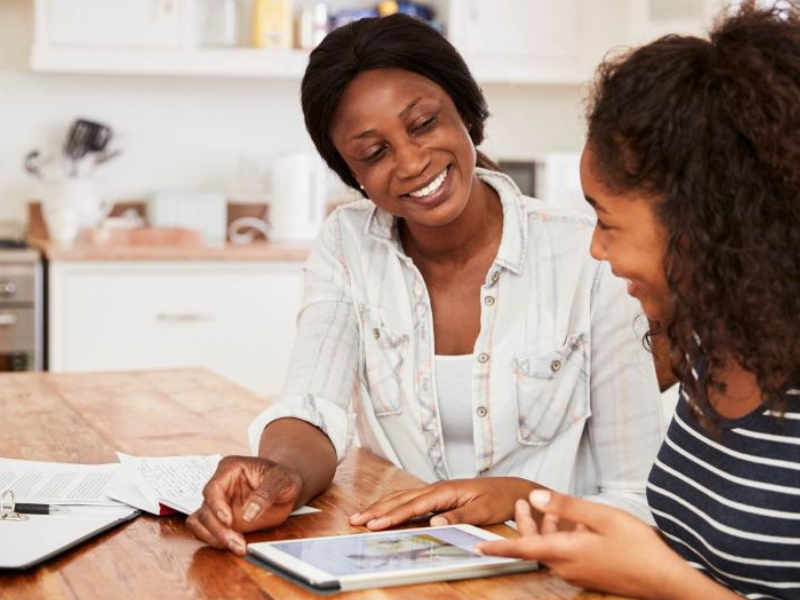 a mother teaching her child the power of compound interest