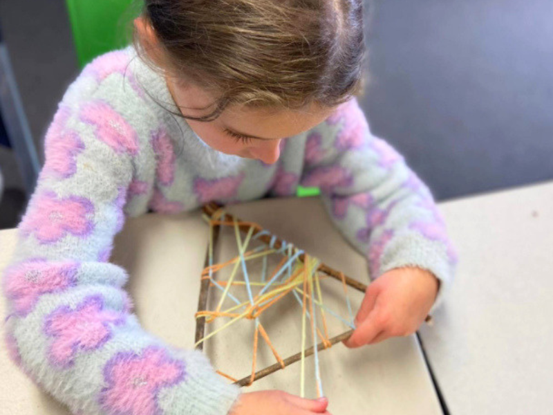 waldorf main lesson child working on a craft activity