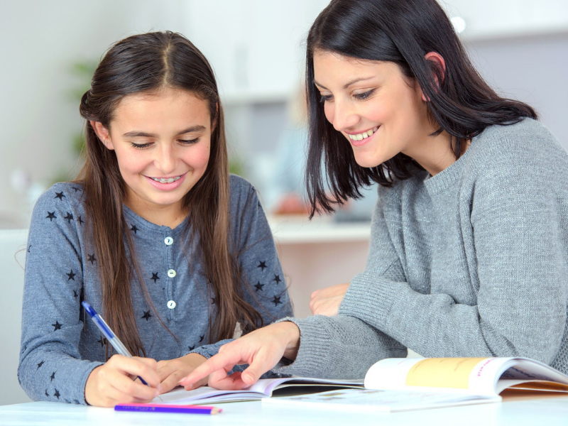 Homeschool girl doing lessons with her mum using Twinkl Australia homeschool resources