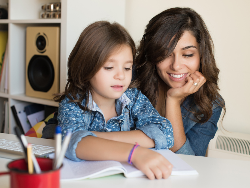 parent and homeschooled child learning together