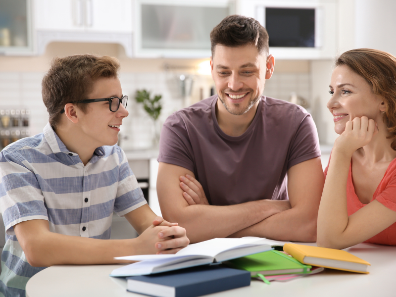 homeschooling teenager with his family 