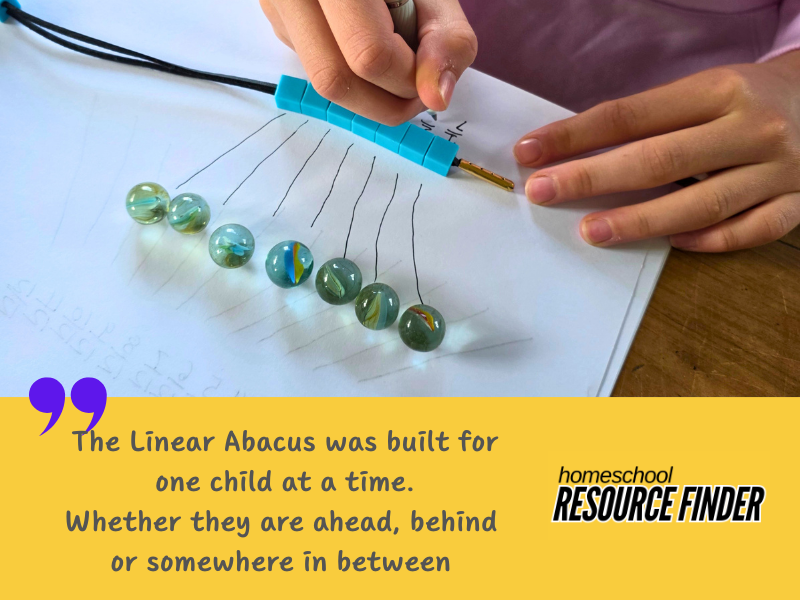 child using the linear abacus and the games book