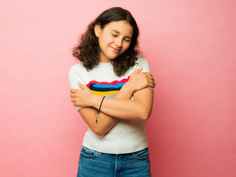 Image of a girl showing self love and compassion