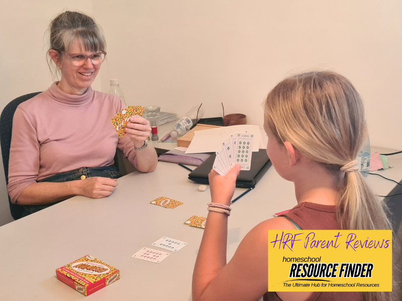 homeschool parent and child playing a game of Numero